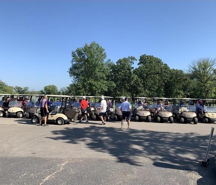 A line of golfers ready to roll out and begin the Bridgeview Chamber golf outing