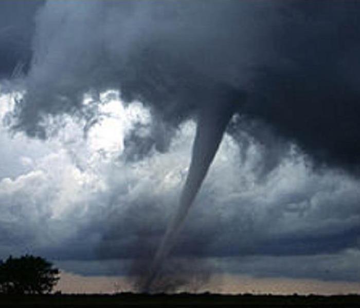 A tornado over a farm field