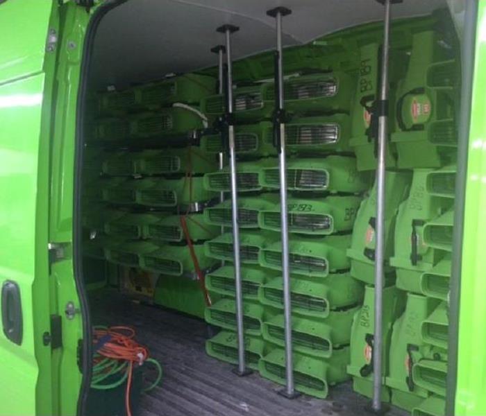 A SERVPRO work truck loaded with equipment