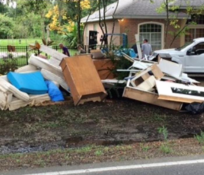 Piles of storm damaged furniture at the curb