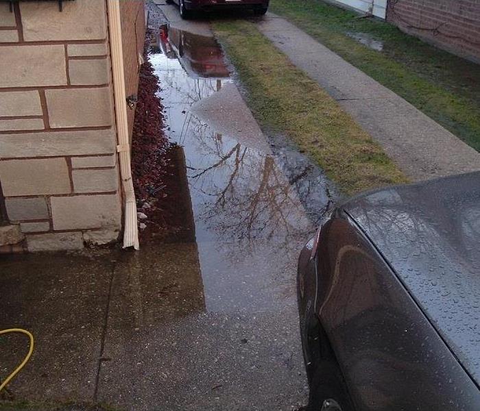 Standing water next to a home
