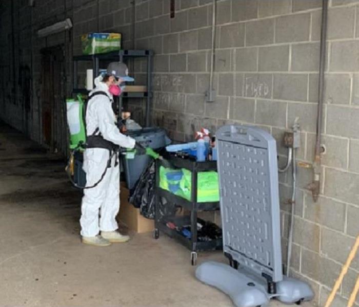 Spraying disinfectant in a warehouse dock area